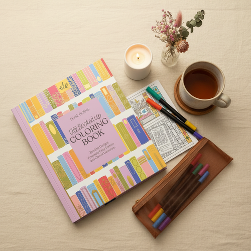 All Booked Up Coloring Book and markers flat lay styled on warm linen with cozy props, no steam
